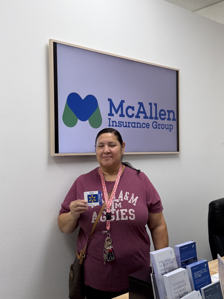 A client at the office holding a giveaway gift card